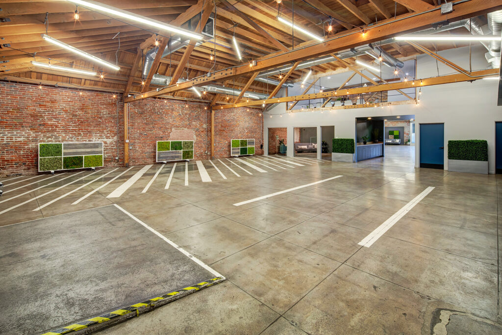 MG Studio Event Space Downtown Los Angeles Renovated Warehouse Connecticut St Room Exposed Brick Polished Concrete Floor Wood Beams String Lights