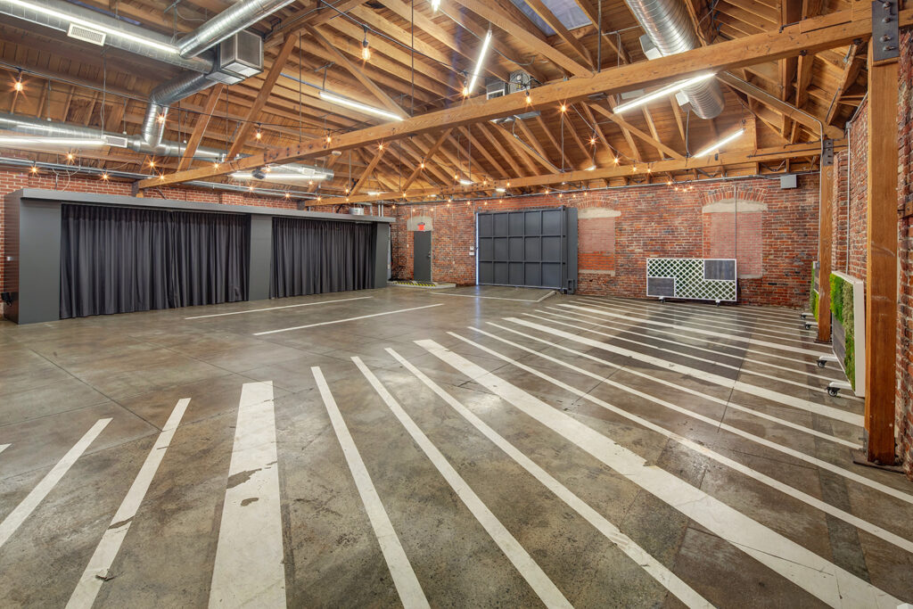MG Studio Event Space Downtown Los Angeles Renovated Warehouse Connecticut St Room Wooden Bow Truss Ceiling Exposed Brick