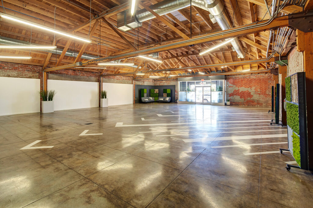 MG Studio Event Space Downtown Los Angeles Renovated Warehouse Main Front Room 11th Street Polished Concrete Floor Wooden Bow Truss Ceiling