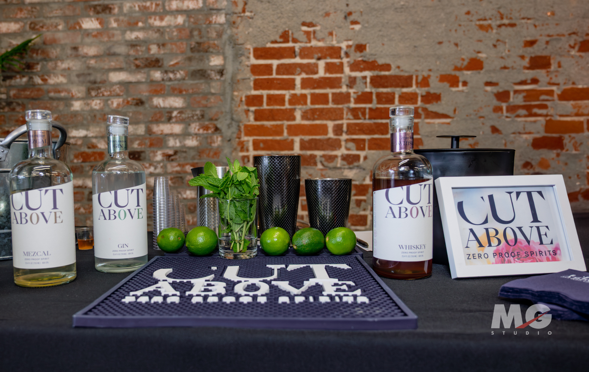 Tasting Event at MG Studio - spirits brand Cut Above Zero Proof Spirits - branded table