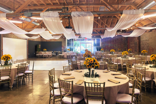 Dinner party at MG Studio - draping, sunflower centerpieces chivari chairs