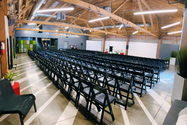 Seminar Seating MG Studio Event Wide View education event black chairs white walls presentation